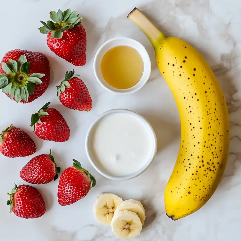 Ingredients for making strawberry yogurt smoothie